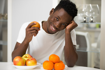 Wall Mural - African man with apples