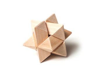 closeup of solved wooden puzzle  on white background