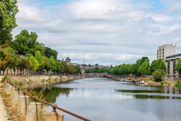 Wall Mural - Banks of the Mayenne river, City of Laval, Mayenne, Pays de Loire, France. August 5, 2018