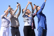 group of young people with smartphones