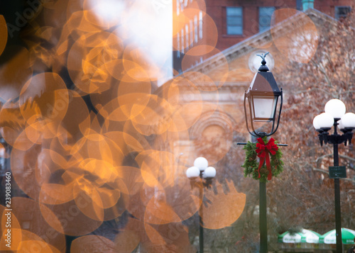 Christmas Decorated Lamppost Seen Through Golden Holiday Lights