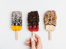 Assorted Popsicles Dipped In Chocolate, Coconut, Sprinkles And Chocolate Chips