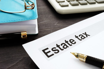 Wall Mural - Estate tax and gavel on a wooden desk.