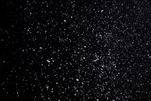 Snow Flakes Falling On Black Background. Winter Weather