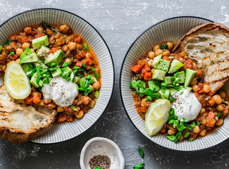 Vegetarian mushrooms chickpea chili on a gray background, top view. Healthy vegetarian food concept