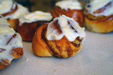 Wall Mural - Pumpkin cinnamon rolls with sugar icing