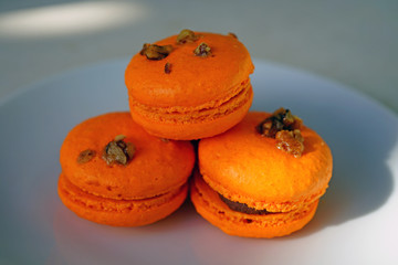 Wall Mural - Colorful orange round macaron cookies 