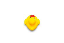 Yellow Toy Duck On A White Background. Flat Lay, Top View