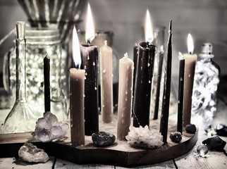 Poster - Retro still life with burning black candles, shining bottles and minerals. Magic ritual. Wicca, esoteric and occult background with vintage witch objects