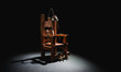 © fergregory - Electric chair in a dark background