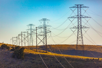 Electrical towers trailing far into the distance