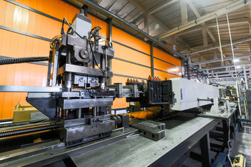 Wall Mural - Roller forming machine. The interior of the plant producing a metal profile.