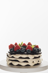 Wall Mural - close-up view of gourmet homemade whoopie pie cake with fresh blueberries and strawberries