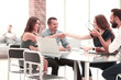 © yurolaitsalbert - group of employees discusses new ideas at a working meeting