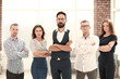 © yurolaitsalbert - confident business team standing in a modern office