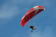 A hang glider in flight with a blue sky 2