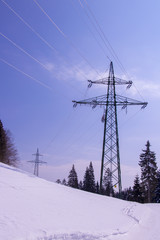 two electric towers in winter