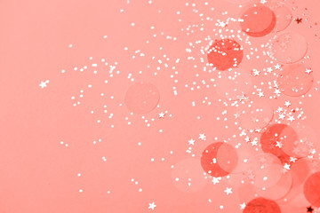 Wall Mural - Living Coral pastel confetti and sparkles background, golden stars. Bright and festive. Color of the year 2019 16-1546. Copyspace for text.