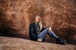 © MeganMahoneyPhotos - Young Cute Modern Caucasian Woman Smiling in Front of Massive Natural Red Rock Stone Wall Outside in Nature at the State Park