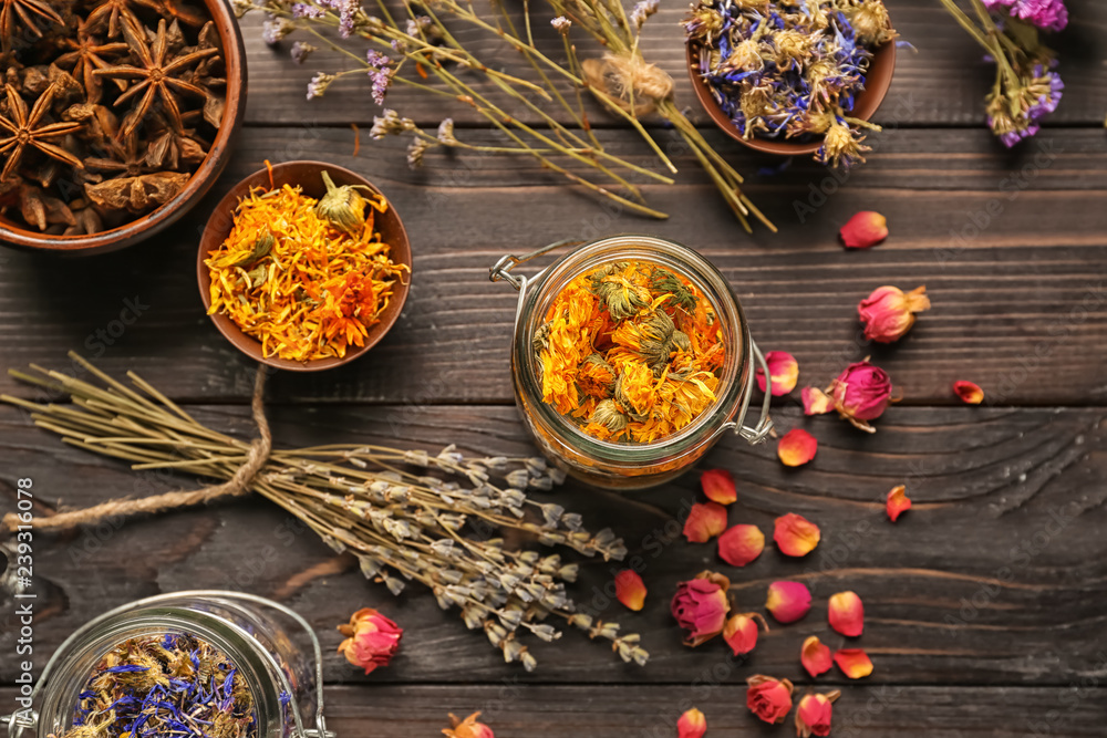 Dried flowers on dark wooden table