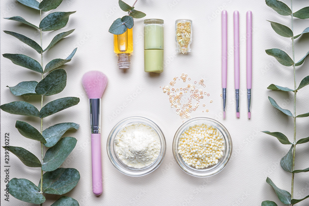 Composition with cosmetic products on light background