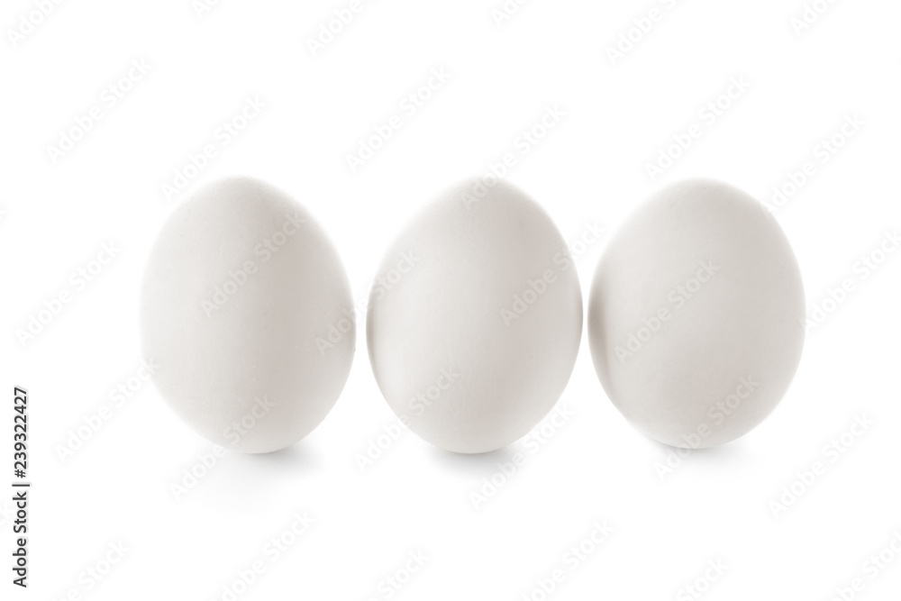 Raw chicken eggs on white background