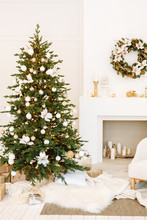 Christmas Decor. Bright Cozy Living Room In White With A Large Beautiful Christmas Tree