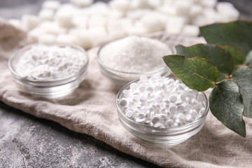 Wall Mural - Bowls with different kinds of sugar on grey table