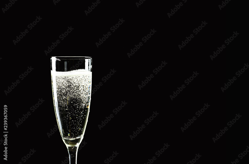 Glass of champagne on dark background