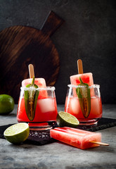 Wall Mural - Spicy watermelon popsicle margarita cocktail with jalapeno and lime. Mexican alcoholic drink for Cinco de mayo party