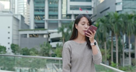 Canvas Print - Woman send audio message on cellphone