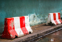 Red White Concret Barrier Stop Going Sign On Street Stand On Footpath Green Painted Old Wall Background