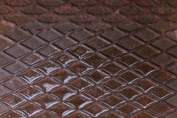 Old rusty metal sheet with mesh