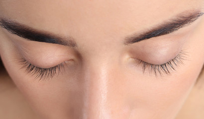 Poster - Young woman with beautiful natural eyelashes, closeup view