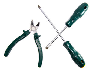 screwdrivers and side cutters on white background