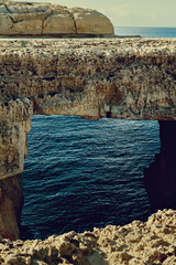 Wall Mural - The Azure Window in Gozo island - Mediterranean nature wonder in beautiful Malta - Unrecognizable touristic scuba divers