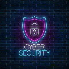 Cyber security glowing neon sign on dark brick wall background. Internet protection symbol with shield and padlock.