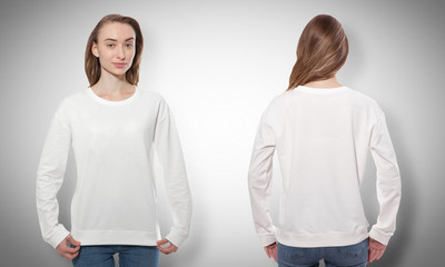 Wall Mural - young woman in white sweatshirt, white hoodies front and rear. grey background