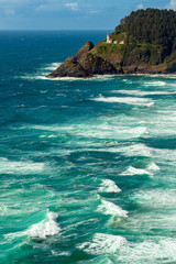 Wall Mural - The Heceta Head Lighthouse above the Pacific ocean in Oregon, USA