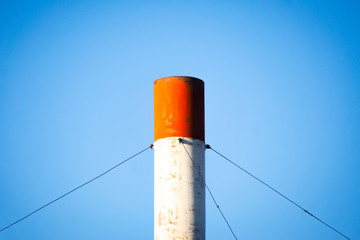 Wall Mural - Pipe against blue sky, industry, environmental pollution