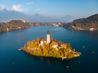 Wall Mural - Aerial view of Bled island on lake Bled, and Bled castle and mountains in background, Slovenia, Europe.