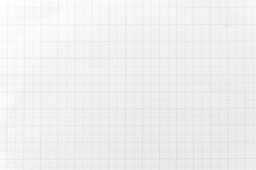 White paper with grid line pattern for background. Close-up.