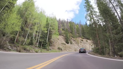 Poster - Driving on paved road in Rocky Mountain National Park.