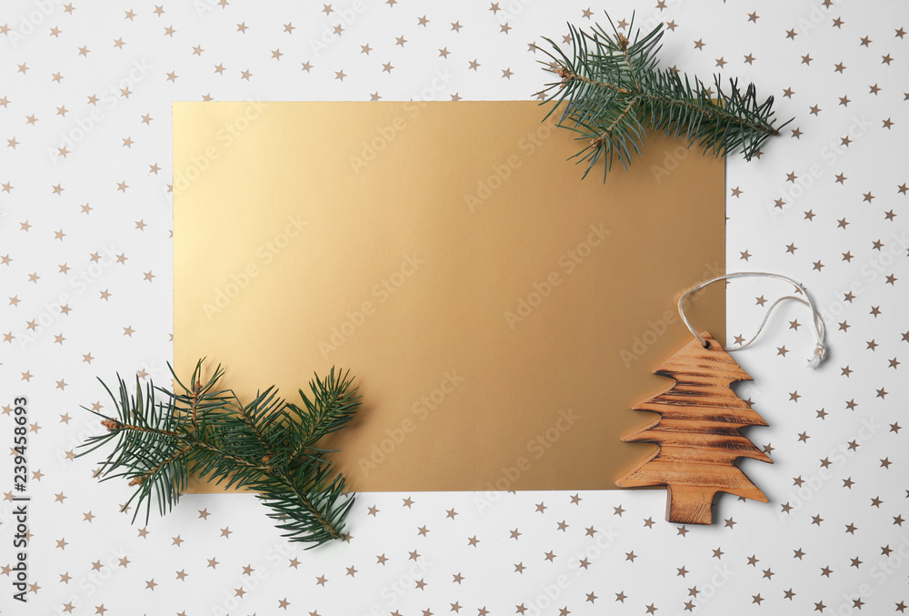 Blank sheet of paper with Christmas decor on light background