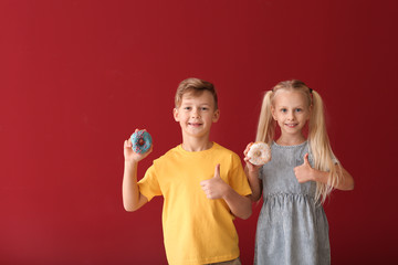 Sticker - Cute little children with donuts on color background