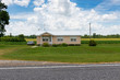 © Tiago Fernandez - A mobile home with a car parked on the driveway in a rural area of the State of Mississippi, near the Mississippi river, USA.
