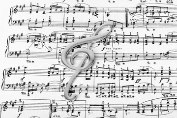 Wall Mural - Treble clef on music sheet - musical background