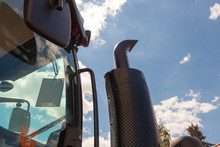 Tractor Exhaust Pipe. Blue Sky Background
