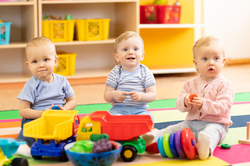 Babies playing together in the kindergarten.