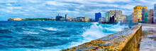 The Havana Skyline And The Iconic Malecon Seawall With A Stormy Ocean